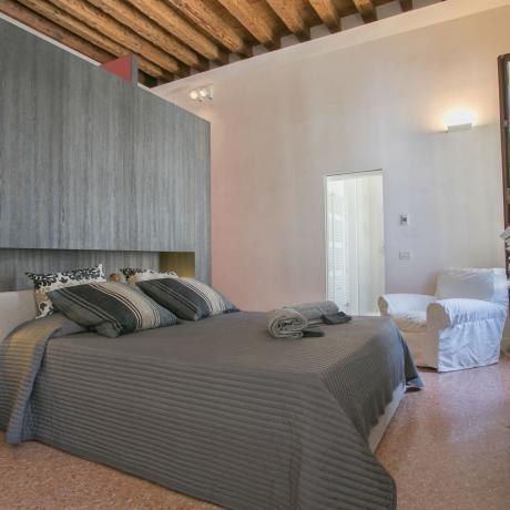 The comfortable master bedroom at Santa Giustina apartment