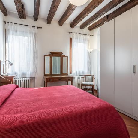 Sunny master bedroom at Corte Zappa apartment