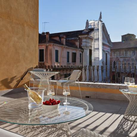 The sunny terrace with canal view at Santa Fosca apartment